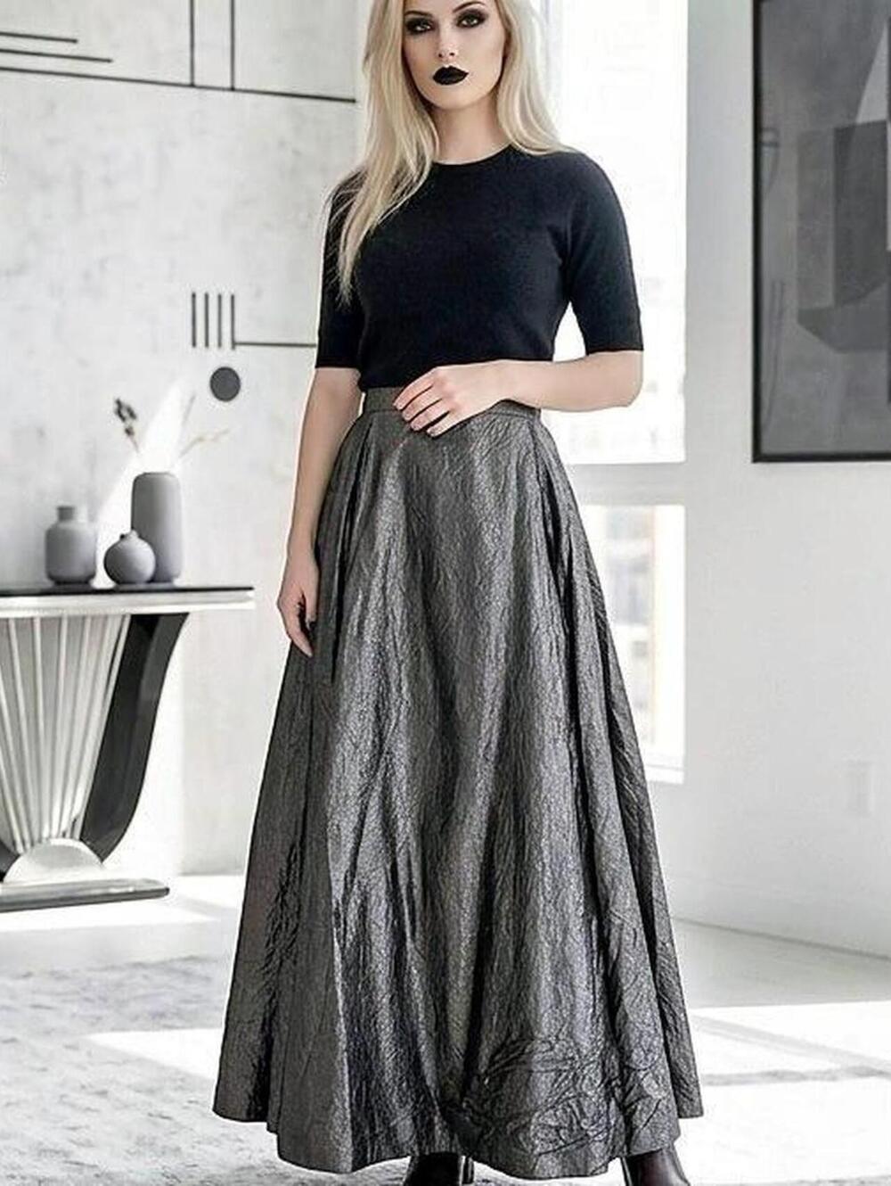 Long metallic charcoal maxi skirt with heavy crinkle texture and wide pleats.